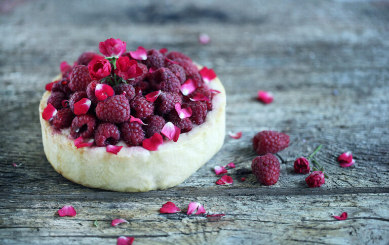 Raspberry deep-dish pie with rose petals